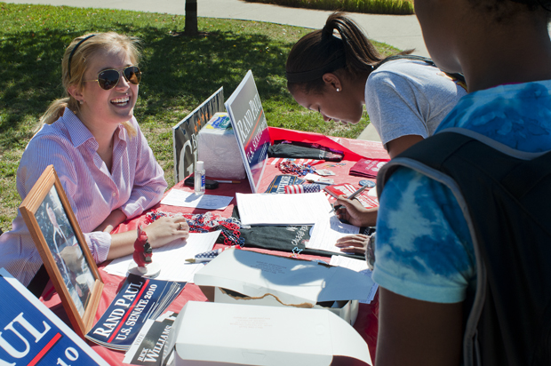 Julia Bright, a Louisville senior, registers Brittney Perry, a Baton Rouge, La., graduate student, and Bryelle Bonds, a Louisville freshman, to vote at the opening event of Constitution week Monday.  Bright is the President of the College Republicans.  