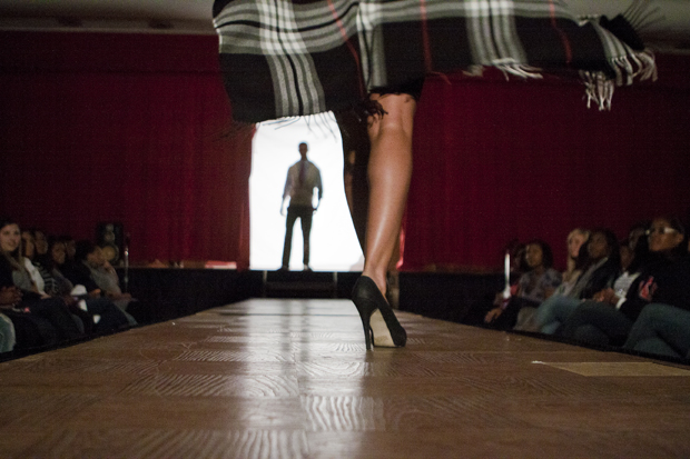 A model walks down the runway during Project Workplace, a business fashion show hosted by Alpha Kappa Psi fraternity on Thursday night in Garrett Ballroom. 