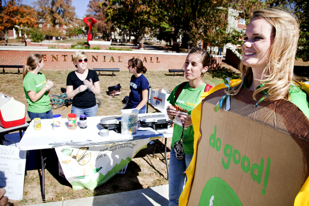 From right to left, Louisville junior Alex Kimura and Louisville sophomore McKenzie Croghan stand in front of the FeelGood table set up in Centennial Mall on Thursday afternoon encouraging students walking by to donate to receive a grilled cheese sandwich. Kimura, who started Feel Good at Western said that the group looks to empower the hungry to be self reliant. TIM HARRIS/HERALD