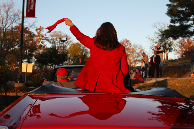 Homecoming Queen candidate Kristin Studle who is sponsored by Alpha Gamma Delta sorority, Alpha Gamma Rho fraternity, Ceres and Kappa Sigma fraternity is taken to the top of the Hill during the Citizens First Homecoming parade on Friday.