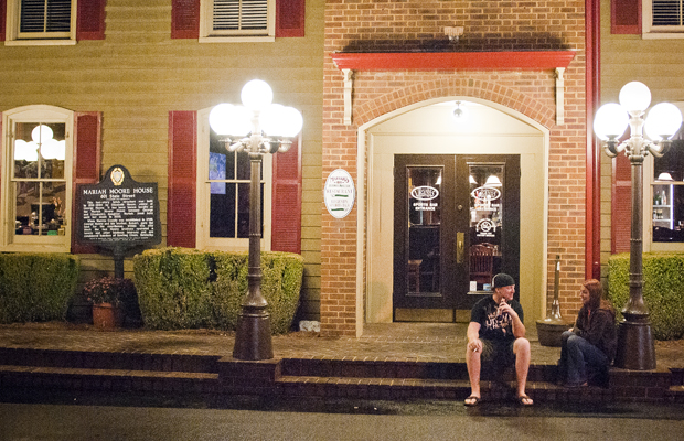 Eric Humphrey, a senior from Tampa, Fla., and Hayley Reddington, a 2009 WKU alumna from Pendelton, Ind., sit outside of Mariah’s Restaurant on Tuesday night.