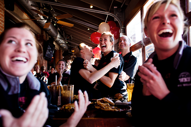 Seniors Tiffany Elmore and Emily Teegarden celebrate the announcement of the Lady Toppers at-large bid the NCAA tournament at Double Dogs restaurant Sunday afternoon.  WKU will play its first game in Champaign, Ill., against the University of Cincinnati on Friday.