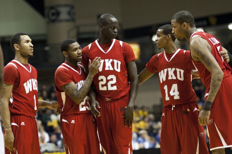 Sophomore center Teng Akol (center) made his WKU debut on Saturday after transferring from Oklahoma State last winter. Akol notched his only point of the game on a free throw in the first half.