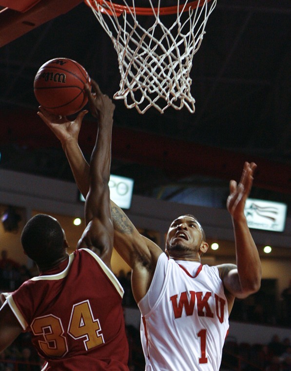 Senior forward Sergio Kerusch is blocked by Denvers Chris Udofia in the first half of Thursdays home game at Diddle Arena. WKU lost 62-59, falling to 0-2 in the Sun Belt Conference.