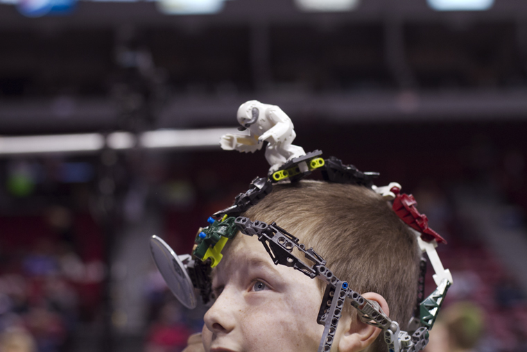 A member of the Ingenious Engineers team watches two of his teammates compete during an afternoon round of the Kentucky FIRST LEGO League State Robotics competition. Students ages 9 to 14 competed, using student-built and programmed robots to execute tasks related to this year’s theme, “Body Forward.”