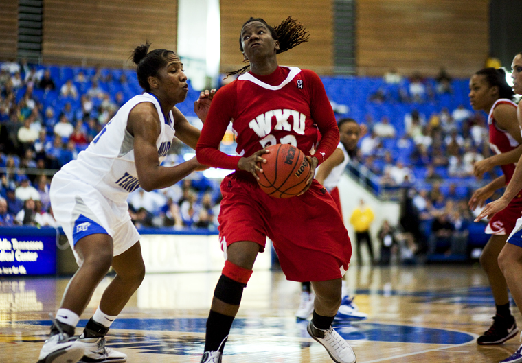 Senior forward Arnika Brown drives to the basket before shooting during Sunday nights game at Middle Tennessee. The Lady Toppers lost, 64-56, in their last regular season game before the Sun Belt tournament begins Saturday in Hot Springs, Ark.