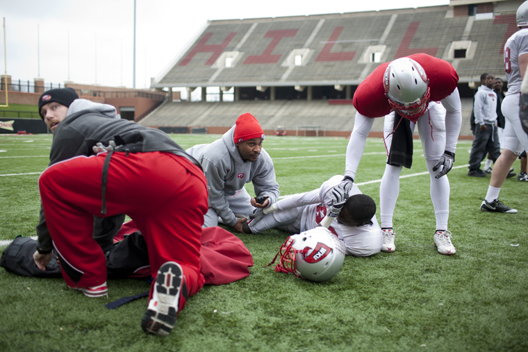 Sophomore receiver Willie McNeal holds his knee while teammates and staff look on at last Wednesday’s practice. Head Coach Willie Taggart said after the practice that McNeal, WKU’s leader in receiving yards last year, will miss the entire 2011 season.