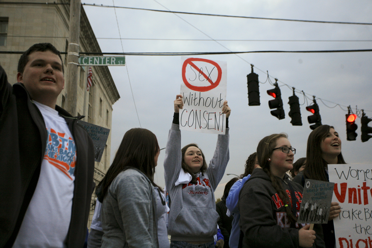 Participants march through downtown Bowling Green during the Take Back The Night event on Thursday evening. Groups from Warren County, along with several other surrounding counties, met at the Justice Center and marched to raise awareness for rape and sexual assault. After the march, there were several speakers, including employees from Hope Harbor, and a candlelight vigil to end the night.