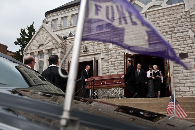 Harriet Downing, the late Dero Downings wife, leaves the church behind her husbands casket before he is taken to his final resting place at the Fairview Cemetery on Friday, April 08, 2011.
