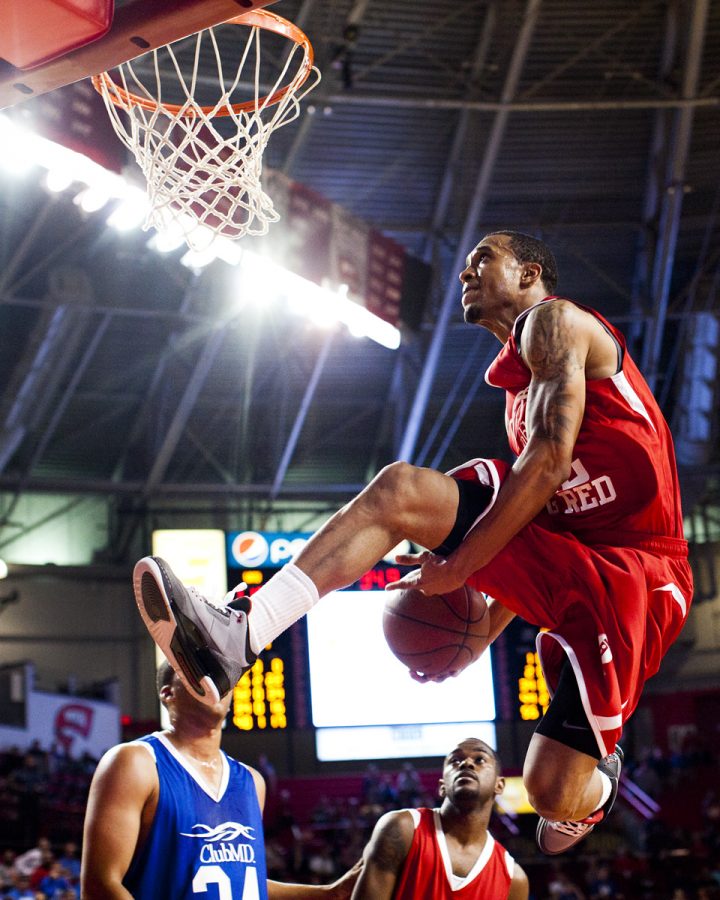 WKU alum guard Courtney Lee makes an between-the-legs dunk late
in the Big Red vs. Big Blue alumni in Diddle Arena on Tuesday
night. The red team defeated the blue team 112-97.

