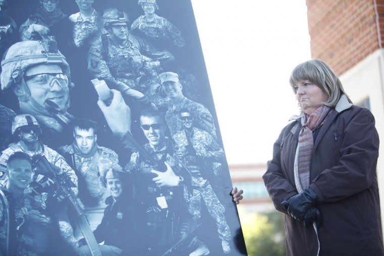 On Veterans Day and in honor of 1st Lt. Eric Yates, a A WKU Army
ROTC graduate who was killed last year in Afghanistan, the
university hosted a ceremony Friday to celebrate his life and
inducted him into the ROTC Hall of Fame. Yates mother, Cathy
Yates, was on hand at Guthrie Bell Tower as a new granite panel
with Yates face on it was unveiled.
