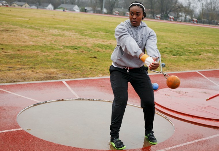 WKU s senior, Monteka Flowers of Indianapolis, Ind., practices
weight throw at the Ruter Track and Field Complex. Flowers
practices throwing a 20 lbs. weight.

