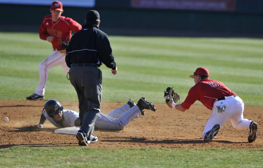 Junior+shortstop+Steve+Hodgins+drops+the+ball+on+Saturday+as+he+tries+to+tag+a+Southern+Illinois+runner+out+at+second+base.+WKU+lost+10-3+at+Nick+Denes+Field.%0A