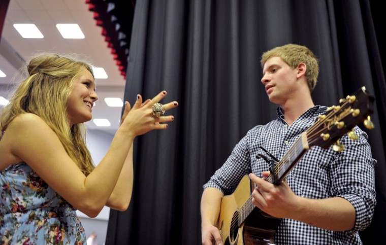 Payton Wardlow, a member of Sigma Phi Epsilon fraternity, laughs backstage while Christen Profanicik, a member of Alpha Omicron Pi, warms up on his guitar before before the fourth annual Can You Duet? hosted by Sigma Kappa sorority Thursday night. Wardlow and Profanicik were partners in the competition.
