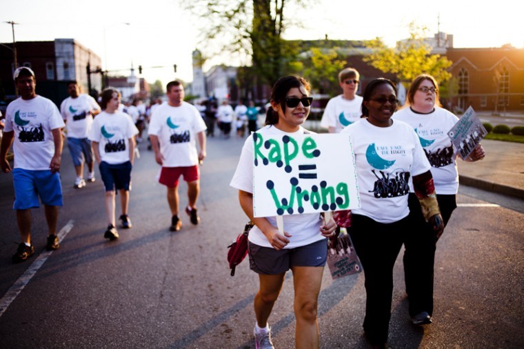WKU graduate student Azalia Gongora of Belize participates in the Take Back The Night march Thursday. The participants started at the Warren County Justice Center and marched one mile around Bowling Green to spread awareness of sexual violence.
