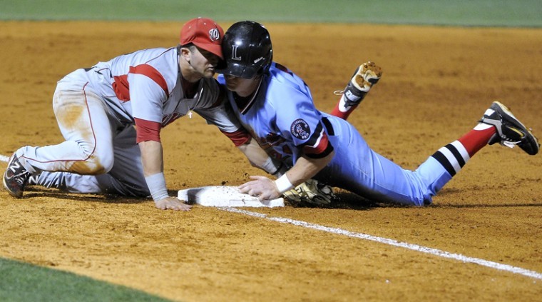 Senior infielder Casey Dykes tags Lipscomb runner out as they collide at third base. WKU won 4-3 against Lipscomb Wednesday night at Dugan Field in Nashville, Tenn.
