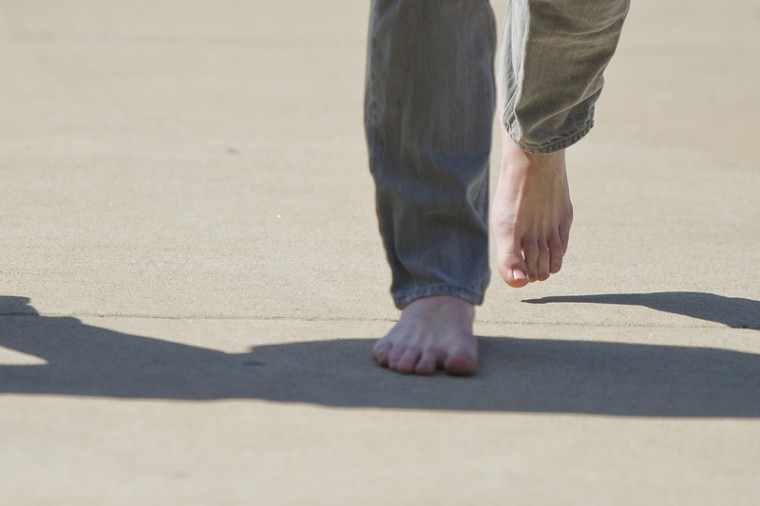 Zach Younglove, a sophomore from McMinnville, Tenn., walks barefoot to his dorm on Tuesday as part of the TOMS annual Day Without Shoes challenge. Intending to raise awareness about impoverished children living without footwear, Younglove chose to go without shoes for a full week.
