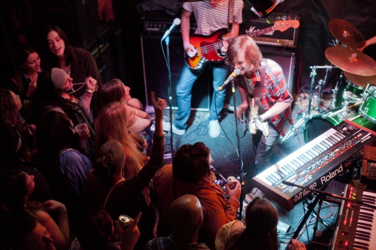 Tiger+Merritt+of+Morning+Teleportation+sings+to+fans+crowding+around+the+stage+at+Tidball%E2%80%99s+on+Tuesday%2C+April+10.+The+band+returned+to+Bowling+Green%2C+their+city+of+origin%2C+from+their+new+home+base+in+Portland%2C+Ore.%2C+to+play+a+show.%0A