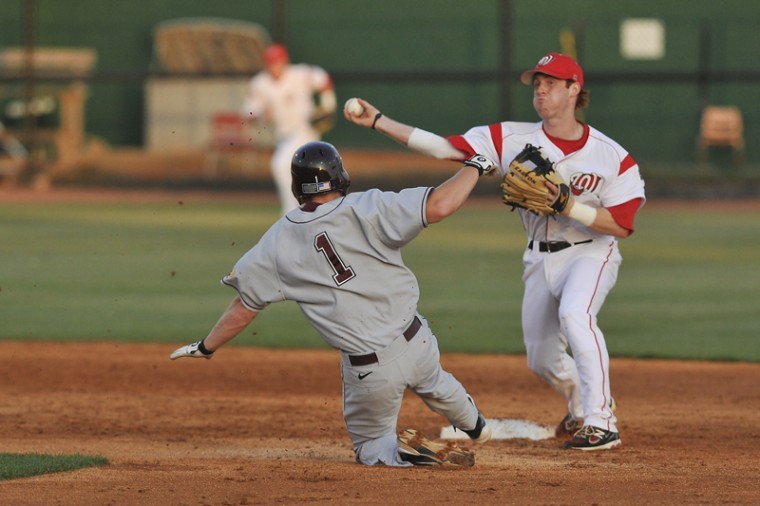 Senior infielder Ivan Hartle attempts to turn a double play against Arkansas-Little Rock at Nick Denes Field on March 30.
