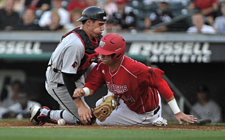 Junior first baseman Ryan Huck slides into home plate in the bottom of the second inning to score a run Tuesday night at Bowling Green Ballpark. WKU beat the No. 18 Louisville 8-1.
