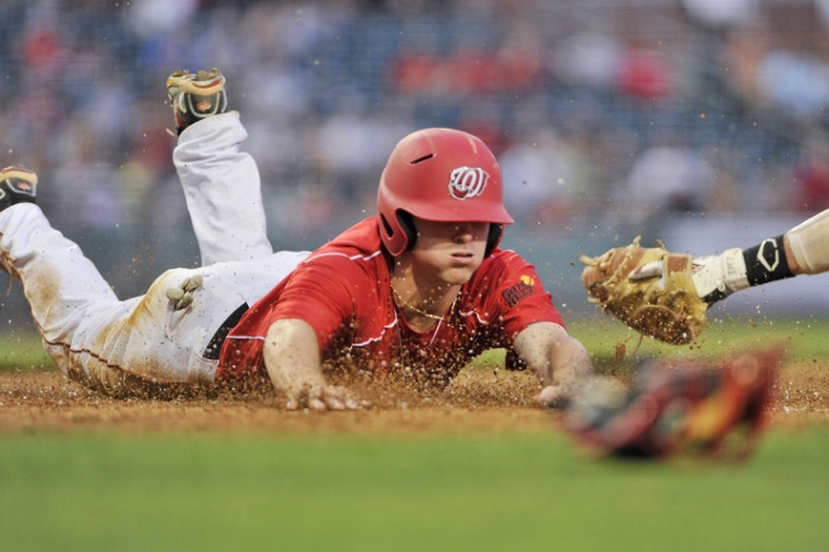 Senior outfielder Jared Andreoli slides into home to score in the bottom of the sixth inning at Bowling Green Ballpark Tuesday night. WKU beat No. 18 Louisville 8-1.
