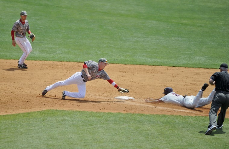 Sophomore infielder Scott Wilcox attempts to tag out a runner stealing second Saturday at Nick Denes Field. WKU beat Louisiana-Monroe 7-6 but lost the other two games in the weekend series.
