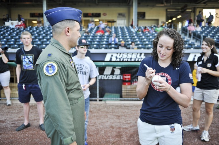 Claire Donahue signs a baseball for Lt. Col. Marcus Carter from Nashville, Tn. Donahue threw out the first pitch at the Hot Rods baseball game on Sep. 06, 2012.
