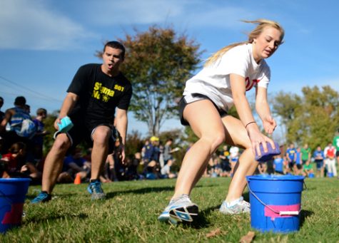 Louisville freshman Alexa Wagoner, of Alpha Omicron Pi, dashes forward to complete the water portion of the Greek Games. Members of the Greek community participated in the games Wednesday.
