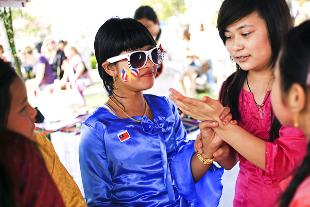 Thet Thet, 12, of Thailand waits with fellow dancers for her performance to begin at the International Festival in Bowling Green on Saturday.
