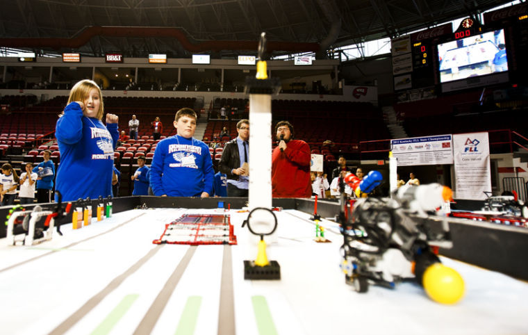 Robinson Elementary Jay Bots Preston Pollard, 12, and Dawson Messer, 11, tense up as they get toward the end of a run during the 2012 Kentucky FIRST LEGO League state robotics championship in Diddle Areana on February 1, 2013.
