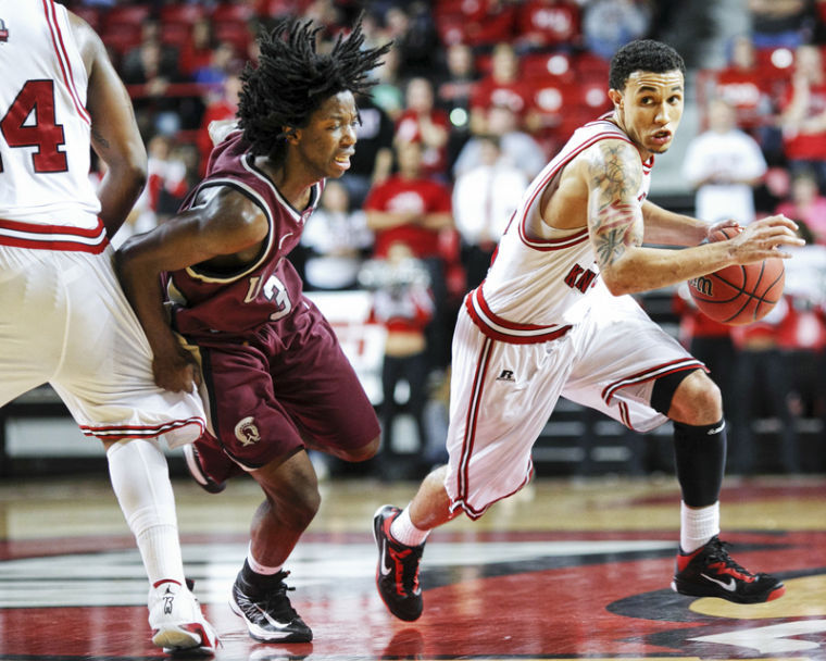 Junior guard Brandon Harris (12) drives past the UALR defense in the second half at E.A. Diddle Arena in Bowling Green, Ky. on Saturday Dec. 19, 2013. 
