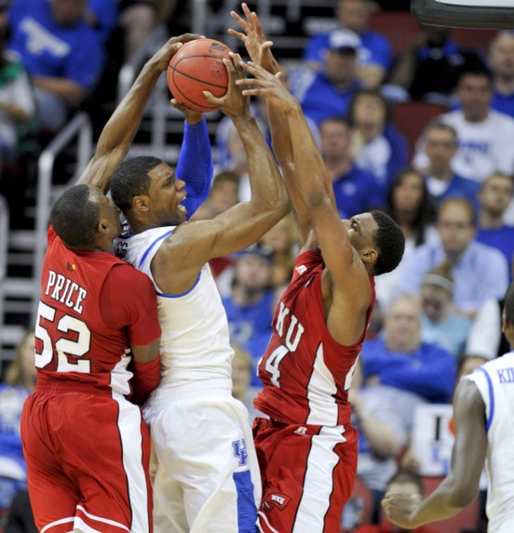 Freshman guard T.J. Price and freshman forward George Fant try to steal the ball from Kentucky forward Terrence Jones during the teams NCAA Tournament game at the KFC Yum! Center in Louisville on Thursday night. UK won 81-66.
