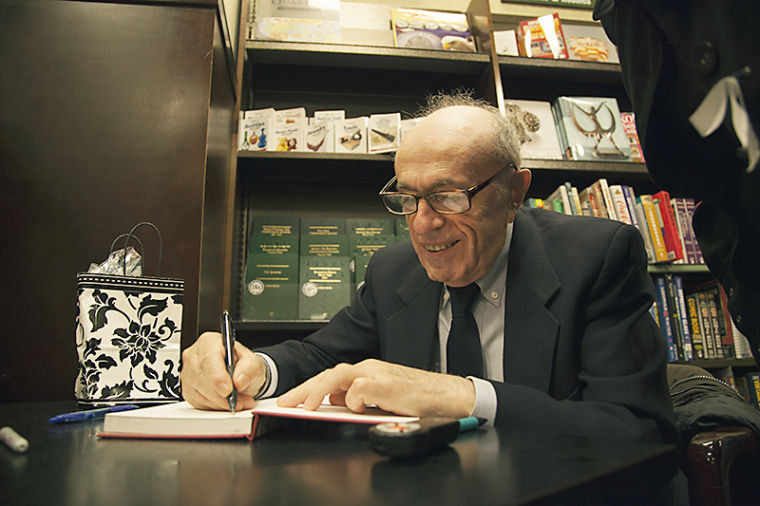 Samuel Marder signs his book “Devils Among Angels: A Journey From Paradise And Hell To Life” Thursday night at Barnes and Noble in Bowling Green. 