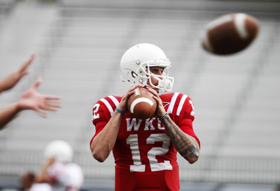 WKU junior quarterback Brandon Doughty takes practices reps in preparation for Saturdays game against rival Kentucky. Doughty is replacing three year starter Kawaun Jakes. Ian Maule/Herald