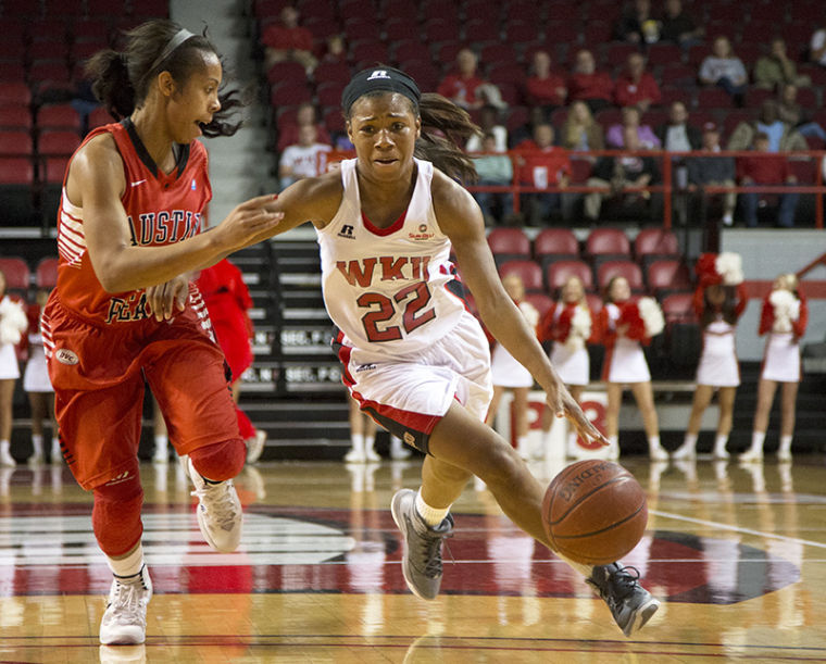 Guard+Bianca+McGee+%2822%29+drives+downcourt+as+guard+April+Rivers+%283%29+tries+to+defend+during+WKU%E2%80%99s+78-75+victory+over+Austin+Peay+Nov.+9%2C+2013%2C+at+E.A.+Diddle+Arena+in+Bowling+Green%2C+Ky.
