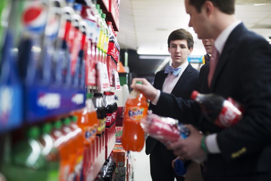 Johnny Busch, a Louisville freshman, left, buys supplies with Kappa Sigma fraternity brothers, Justin Swails, a Clarksville, Tenn. sophomore, middle, and Nick Jacobs, a Jeffersonville, Ind. junior, right, for their spring rush at the Jr. Food Store on the corner of 13th and Center streets on Jan. 28. (Brian Powers/HERALD)