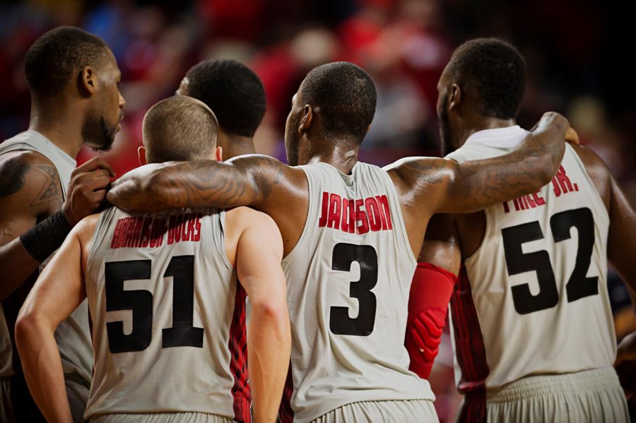 From left, WKUs George Fant, Chris Harrison-Docks, Trency Jackson, and T.J. Price congratulate each other after coming from behind to beat Murray State 71-64 at E.A. Diddle Arena on Saturday, December 21, 2013.