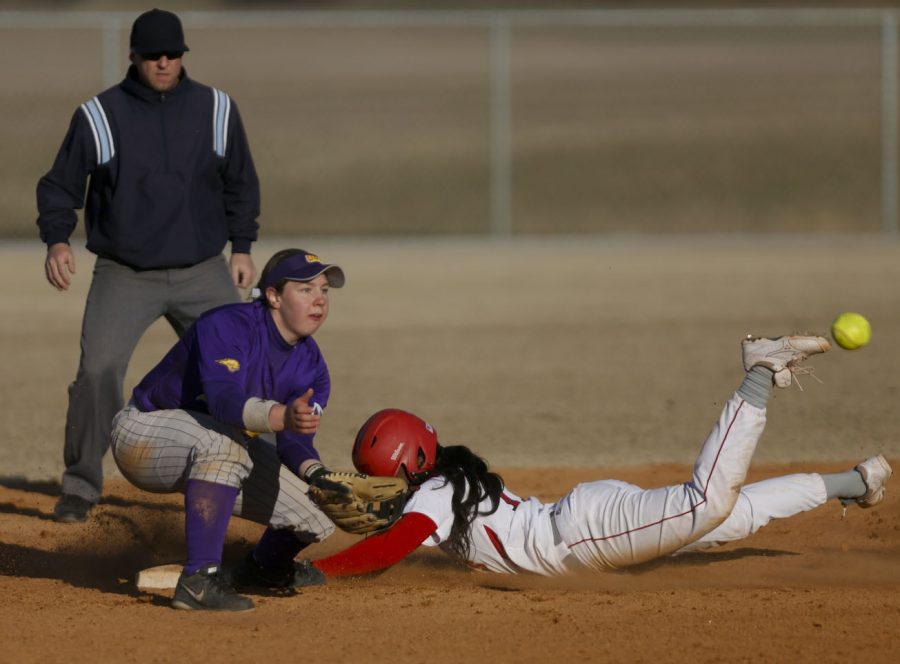 Senior infield Olivia Watkins (17) slides into second base before being tagged out at the womens softball game against the University of Northern Iowa on Friday, February 28 at Buchanon Park in Bowling Green, Ky. The tops lost 3-6. (Kreable Young/HERALD)