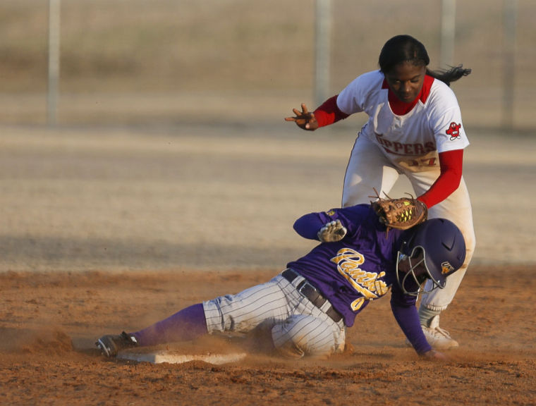 Senior infield Olivia Watkins (17) attempts to tag out a slide into second base at the womens softball game against the University of Northern Iowa on Friday, February 28 at Buchanon Park in Bowling Green, Ky. The tops lost 3-6. (Kreable Young/HERALD)