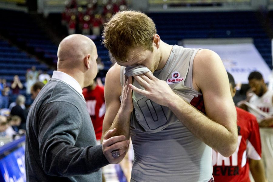 WKUs redshirt senior Caden Dickerson reacts after what will likely be his last game as a Hilltopper, a 73-72 loss to the University of Louisiana Lafayette in the semifinal round of the Sun Belt Tournament Saturday, March 15, 2014, at Lakefront Arena in New Orleans, La. (Mike Clark/HERALD)