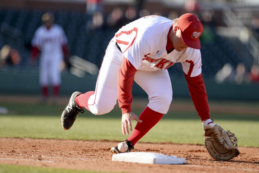 WKU junior infielder Ryan Church attempts to recovery the baseball thrown to him at first base during WKUs 5-3 lost against Louisville at the Bowling Green Ballpark in Bowling Green, Ky on Wednesday March 26, 2014. (Jeff Brown/HERALD)