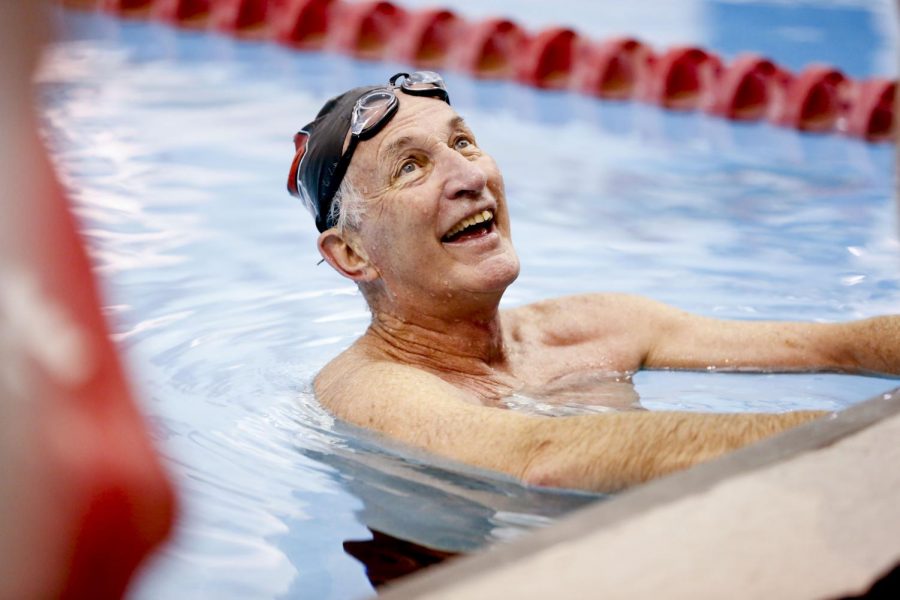 Coach Bill Powell finishes his 77th lap for his 77th Birthday swim at Bill Powell Natatorium at the Preston Center. I get lost in the pool, he said. Thats where my whole focus is and all the problems in the world disappear.