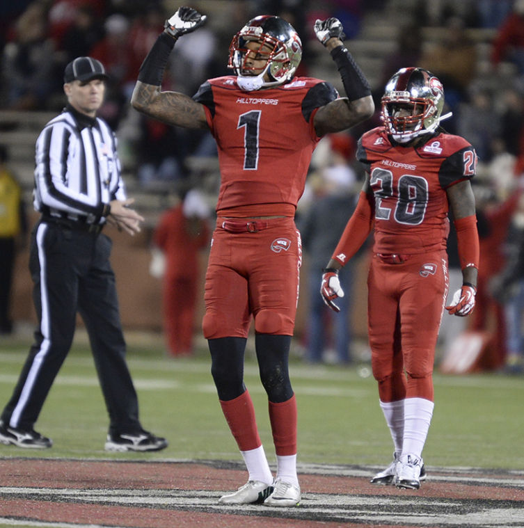 Junior Jonathan Dowling gets the crowd pumped up during the game. WKU won 34-31 against Arkansas State on Nov. 30, 2013 at Houchens-Smith Stadium. 