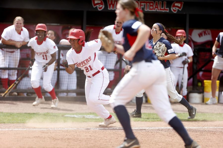Senior outfielder Kelise Mattox runs home after a passed throwing error by South Alabama during the first game of their double header Saturday. The Lady Toppers lost 3-2. (Ian Maule/HERALD)