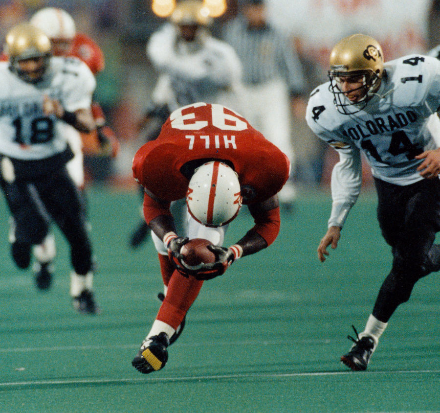 Nebraskas Travis Hill (93) picks up a fumble after stripping the ball from Colorado quarterback Koy Detmer (right) during the 1992 game at Memorial Stadium. Hills fumble recovery set up Calvin Jones 1-yard touchdown run with one second left in the first half of NUs 52-7 win.