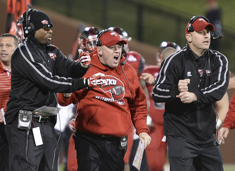 November 30, 2013, Bowling Green, Kentucky, USA_ | WKU coaches yell to the players for the next play. WKU won 34-31 against Arkansas State on Nov. 30, 2013 at Houchens-Smith Stadium.