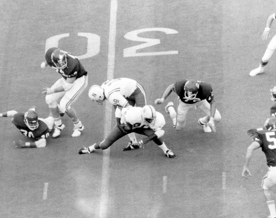 Nebraskas Johnny Rodgers (20) weaves his way through Oklahoma defenders for a 72-yard punt return in the first quarter of NUs 35-31 victory against the Sooners in the Game of the Century.