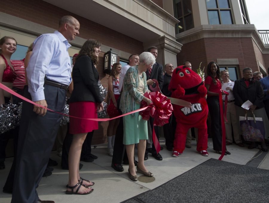 President Gary Ransdell, Harriet Downing and Alex Downing, the wife and son of former WKU President Dero Downing participate in a ribbon cutting and dedication for the newly renovated Downing Student Union on Aug. 29. Nick Wagner/HERALD