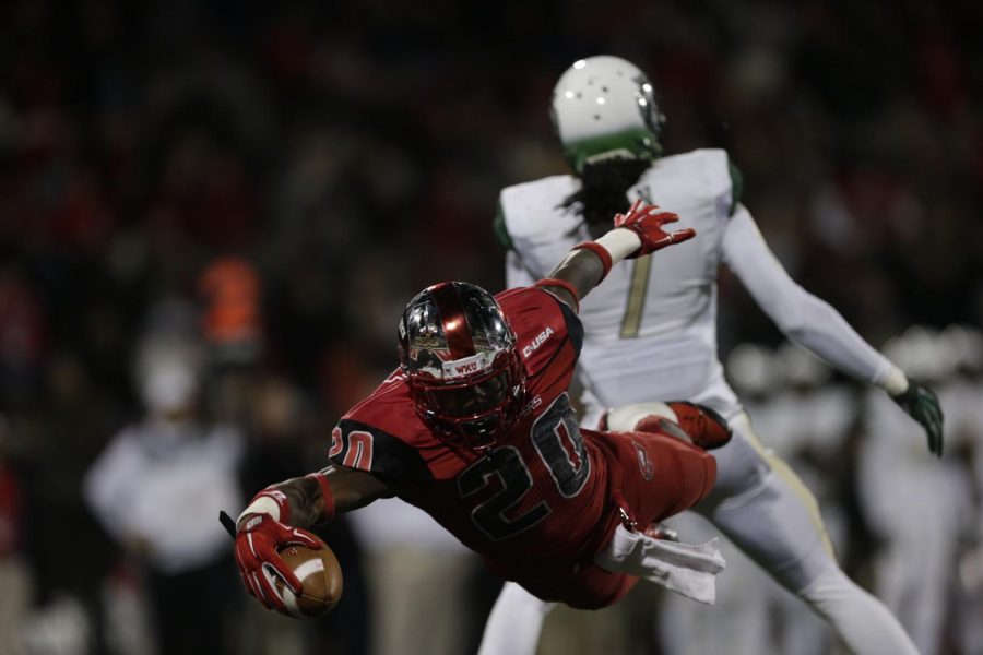 WKU redshirt sophomore running back Anthony Wales (20) makes a superman dive into the end zone during the first half against Conference USA opponent University of Alabama-Birmingham (UAB) Saturday October 4, 2014 at Smith Stadium in Bowling Green, Ky. Despite rushing for 138 yards and three scores Wales could not propel the Hilltoppers to victory in a disappointing 42-39 loss that saw the WKU defense allow 591 yards on offense, a season high. Luke Franke/HERALD