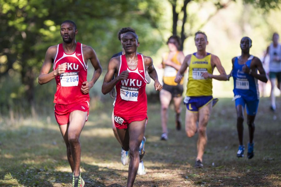 Bultfontein, South Africa senior David Mokone and Uganda sophomore Peter Agaba run in the Greater Louisville Classic at Tom Sawyer Park in Louisville on Oct. 4. Justin Gilliland/HERALD